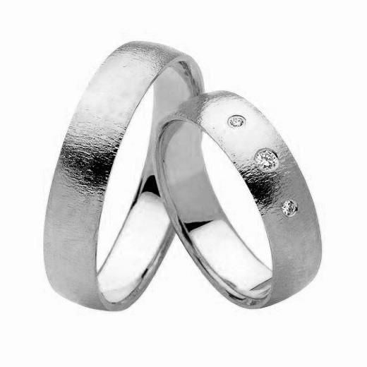 Eksklusive Nuran vielsesringe i 14 kt hvidguld med 0,04 ct diamanter – klassisk design med tre diamanter i dameringen.